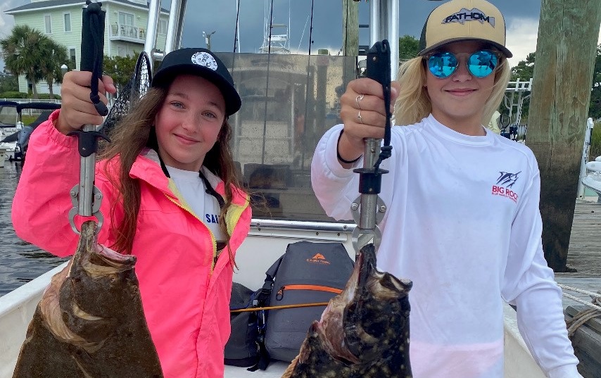 Girls with flounder a